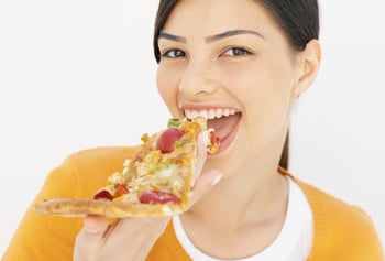 getty_rf_photo_of_teen_eating_pizza.jpg